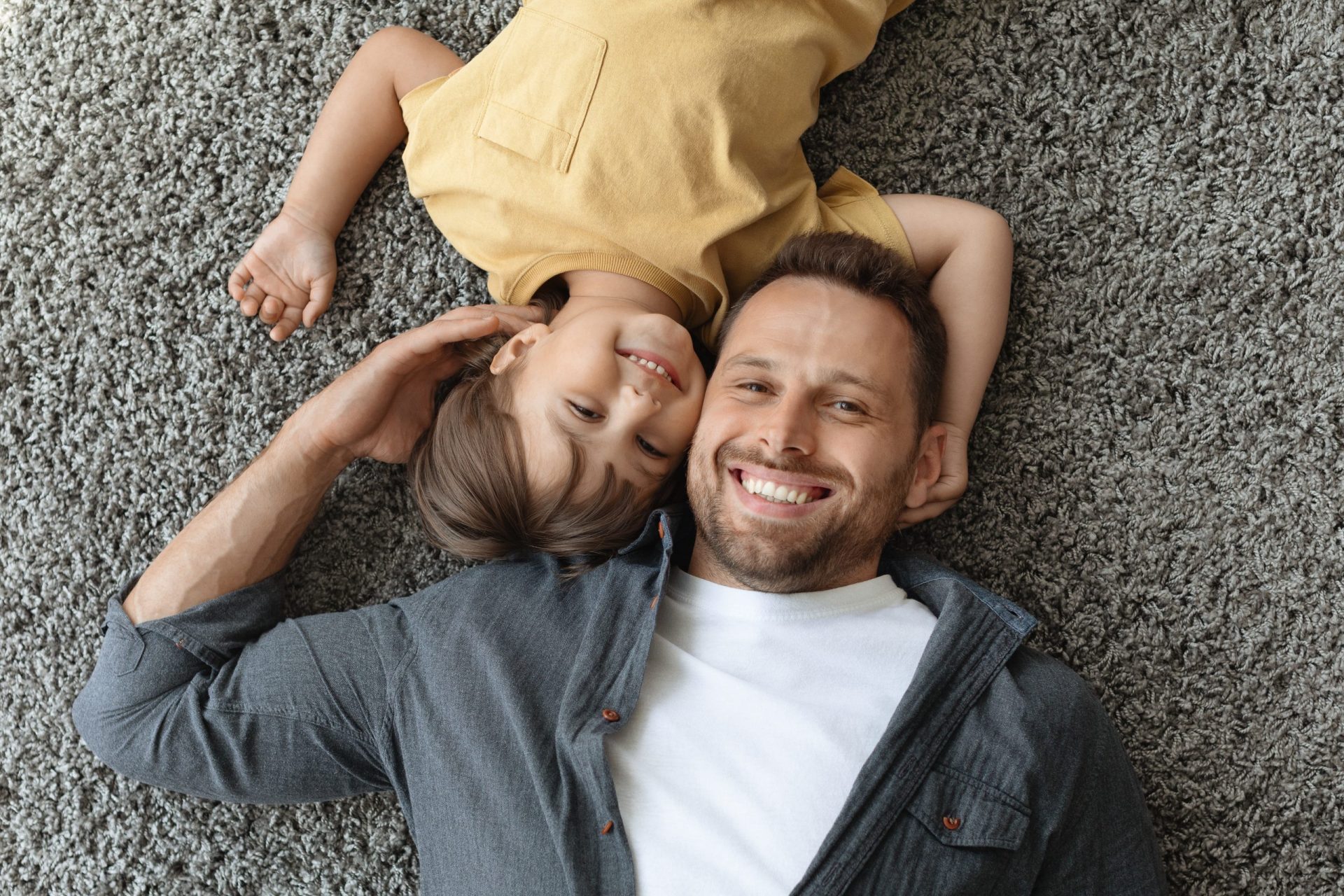 Smiling father and son in Morris County, family law concept.